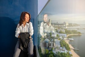 Person looking out over the city with a calm, hopeful expression, representing the benefits of ketamine treatment for depression and renewed emotional clarity.