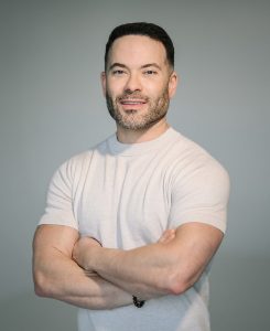 Eiad Asbahi, founder of Mindscape 3/4 shot in white t-shirt with black grey background.